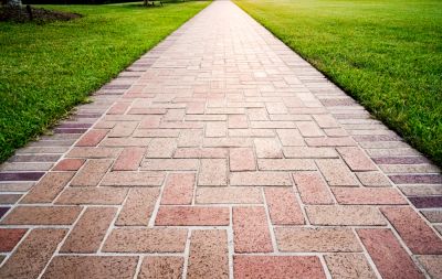 Protect Your Landscaping From Damage and Foot Traffic By Getting a Brick Path Installed!